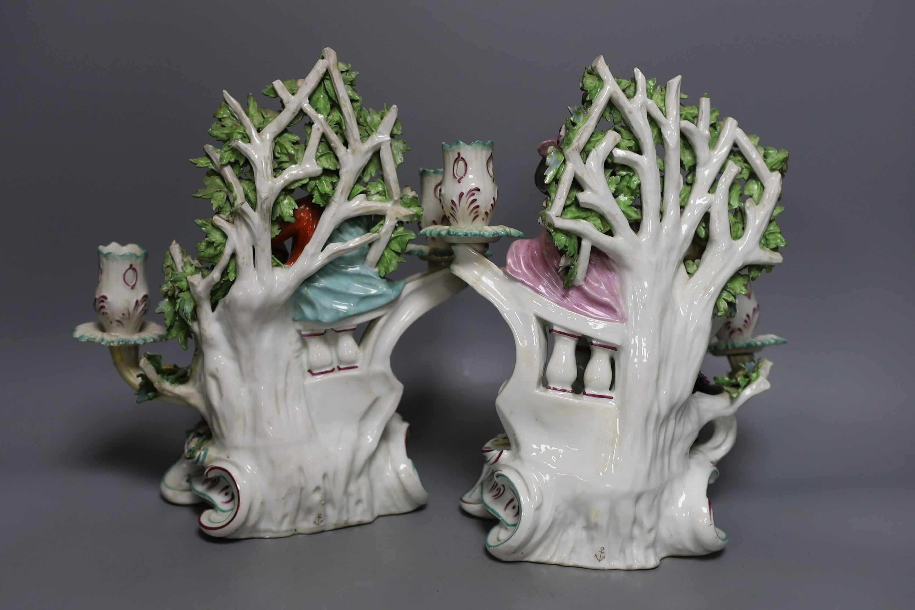 A pair of Chelsea Derby twin sconce candelabra figures, c.1770 - 28cm tall